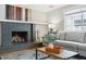 Living room showcases gray brick fireplace, neutral paint, and stylish decor for a comfortable atmosphere at 6537 S Brentwood Way, Littleton, CO 80123