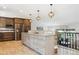 Beautiful kitchen with stainless steel appliances, an island with seating, and rustic wood accents at 6537 S Brentwood Way, Littleton, CO 80123