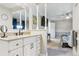 Primary bathroom featuring a granite countertop vanity and open access to the Primary bedroom at 6537 S Brentwood Way, Littleton, CO 80123