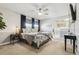 Serene main bedroom features a neutral color scheme and ample natural light from large windows at 6537 S Brentwood Way, Littleton, CO 80123