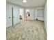 Spacious carpeted room with neutral tones, offering a versatile living space at 912 S Dearborn Way # 3, Aurora, CO 80012