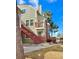 The exterior shows a stairway to the condo above and a balcony area with view of the neighborhood at 912 S Dearborn Way # 3, Aurora, CO 80012
