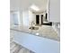 Well-lit kitchen with a granite countertop, stainless steel sink, and modern appliances at 912 S Dearborn Way # 3, Aurora, CO 80012