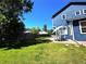 Spacious backyard featuring a well-maintained lawn and patio with an outdoor dining set at 16840 Hoot Owl Ct, Parker, CO 80134