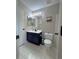 Bathroom featuring a vanity, toilet, and shower/tub combo for complete bathing needs at 16840 Hoot Owl Ct, Parker, CO 80134
