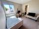Cozy bedroom featuring a bed, desk, and attached bathroom for added convenience at 16840 Hoot Owl Ct, Parker, CO 80134