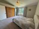 Bedroom with ceiling fan, carpet, large closet, and large window at 16840 Hoot Owl Ct, Parker, CO 80134
