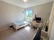 Bright bedroom with a single bed, desk, and a large window offering plenty of natural light at 16840 Hoot Owl Ct, Parker, CO 80134