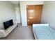 Bedroom featuring a bed, large closet with sliding doors, and carpeted floor at 16840 Hoot Owl Ct, Parker, CO 80134