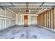 Spacious unfinished garage with ample room for parking and storage at 16840 Hoot Owl Ct, Parker, CO 80134