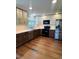 Modern kitchen with stainless steel appliances, quartz countertops and ample cabinet space at 16840 Hoot Owl Ct, Parker, CO 80134