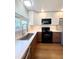 Modern kitchen with stainless steel appliances, quartz countertops and ample cabinet space at 16840 Hoot Owl Ct, Parker, CO 80134
