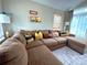 Cozy living room with a comfortable sectional sofa, perfect for relaxing and entertaining at 16840 Hoot Owl Ct, Parker, CO 80134