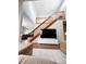Bright living area with a staircase and a large TV, creating a welcoming atmosphere at 16840 Hoot Owl Ct, Parker, CO 80134