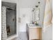 Modern bathroom featuring a double vanity and stylish shower at 3363 W 32Nd Ave, Denver, CO 80211