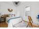 Bright bedroom with white walls, hardwood floors, and stylish decor features, creating a cozy and modern space at 3363 W 32Nd Ave, Denver, CO 80211