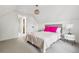 Bright bedroom with soft carpet and light and view to an attached bathroom at 3363 W 32Nd Ave, Denver, CO 80211