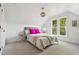 Bright bedroom featuring a large window and cozy decor at 3363 W 32Nd Ave, Denver, CO 80211