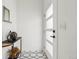 Bright foyer featuring stylish black and white tiling and contemporary decor at 3363 W 32Nd Ave, Denver, CO 80211