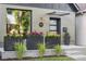 Inviting front entrance with modern planters, stylish lighting, and a contemporary door at 3363 W 32Nd Ave, Denver, CO 80211