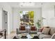 Comfortable living area with modern furniture, large window, and bright, airy feel at 3363 W 32Nd Ave, Denver, CO 80211