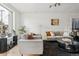 Bright living space featuring neutral tones, comfortable seating, and modern decor at 3363 W 32Nd Ave, Denver, CO 80211