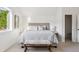Comfortable bedroom with a bench and window view, providing a serene and relaxing space at 3363 W 32Nd Ave, Denver, CO 80211