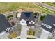 Aerial view of a two-story house with solar panels on the roof and a play area at 7137 S Vandriver Way, Aurora, CO 80016