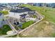 Aerial view of a two-story house featuring a deck, a patio, and a play area at 7137 S Vandriver Way, Aurora, CO 80016