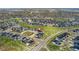 An aerial view of the home in a residential neighborhood, with mature trees at 7137 S Vandriver Way, Aurora, CO 80016