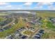 An aerial view of the home in a residential neighborhood, near a lake at 7137 S Vandriver Way, Aurora, CO 80016