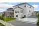 Exterior of house, with patio, deck and backyard of landscaped lawn at 7137 S Vandriver Way, Aurora, CO 80016