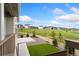 Back yard view with turf, partial fence, and green space at 7137 S Vandriver Way, Aurora, CO 80016