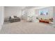 Finished basement with sitting area, playroom, and storage with carpet and neutral-colored walls at 7137 S Vandriver Way, Aurora, CO 80016