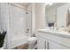 Bright bathroom features a shower over tub with white subway tiles and modern fixtures at 7137 S Vandriver Way, Aurora, CO 80016