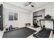 Finished basement gym with exercise equipment, weights, a bench, and window access for light at 7137 S Vandriver Way, Aurora, CO 80016