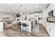 Modern kitchen with a spacious island, stainless steel appliances, and sleek cabinetry, perfect for culinary enthusiasts at 7137 S Vandriver Way, Aurora, CO 80016