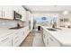 Modern kitchen with stainless steel appliances, sleek countertops, and ample cabinet space, perfect for gourmet cooking and dining at 7137 S Vandriver Way, Aurora, CO 80016