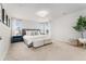 Bright primary bedroom featuring two bedside tables and large windows with lots of natural light at 7137 S Vandriver Way, Aurora, CO 80016