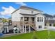 Two-story home featuring a deck, a play area, and a well-maintained lawn at 7137 S Vandriver Way, Aurora, CO 80016