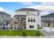 Two-story home featuring a deck, well-maintained lawn, and a charming white picket fence at 7137 S Vandriver Way, Aurora, CO 80016