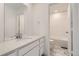 Bathroom with single vanity, marble-look floors and a tub at 4823 Astor Pl, Brighton, CO 80601