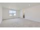 Spacious bedroom with carpet flooring and a view at 4823 Astor Pl, Brighton, CO 80601