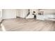 Spacious living room with light wood-look flooring at 4823 Astor Pl, Brighton, CO 80601