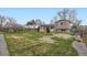 Expansive backyard featuring a well-maintained lawn, a charming pergola-covered deck, and privacy fence at 11121 W 107Th Pl, Westminster, CO 80021