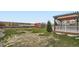 Large backyard with a shed, wooden fence, and a charming pergola-covered deck at 11121 W 107Th Pl, Westminster, CO 80021