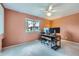Bedroom featuring a large window providing natural light and a ceiling fan at 11121 W 107Th Pl, Westminster, CO 80021