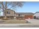 Charming two-story home with well-maintained front yard landscaping and a two-car garage at 11121 W 107Th Pl, Westminster, CO 80021