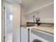 Convenient laundry room equipped with modern washer and dryer units, simplifying chores at 11121 W 107Th Pl, Westminster, CO 80021
