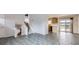 Open-concept living area featuring stylish tile flooring and a staircase to the upper level at 11121 W 107Th Pl, Westminster, CO 80021